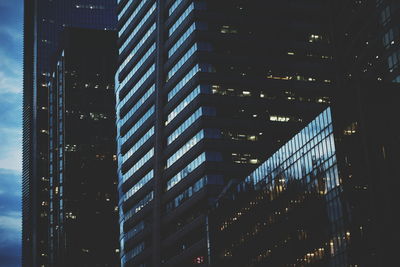 Low angle view of modern building at night