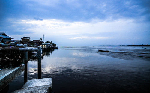 Scenic view of sea against cloudy sky