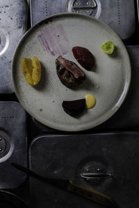 High angle view of fruits in plate on table