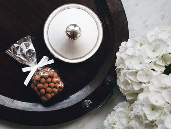 Directly above shot of food and flowers on floor at home