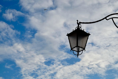 Low angle view of street light against sky