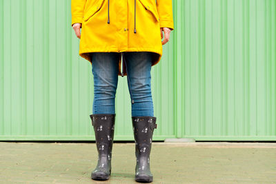 Low section of woman walking on floor