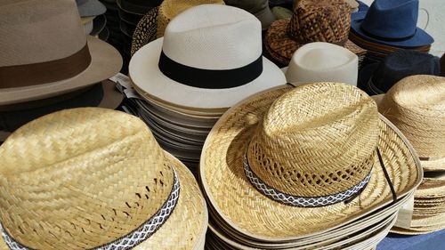 Stack of sun hats for sale in market