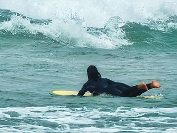 Man swimming in sea