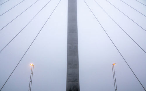 Low angle view of illuminated street light against sky