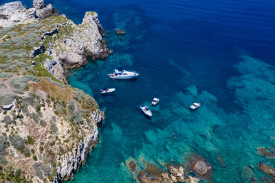 High angle view of sailboats in sea