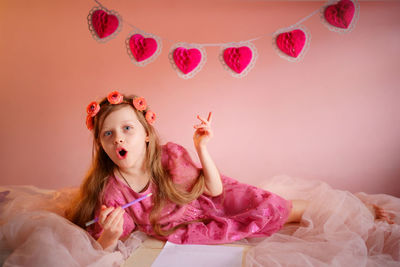 Girl writes a valentine