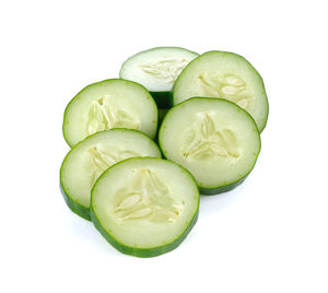 Close-up of green chili over white background