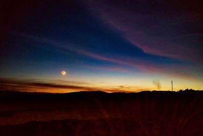 Scenic view of mountains against sky during sunset