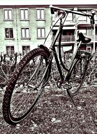 Close-up of bicycle against building