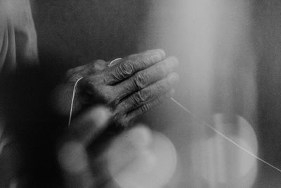 Close-up of hands against blurred background