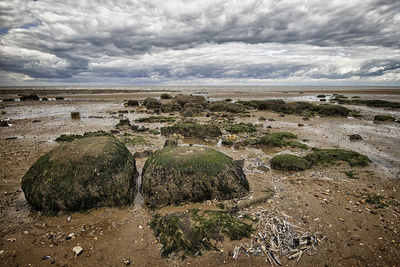 Scenic view of sea against cloudy sky