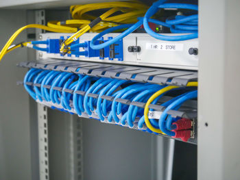 Close-up of multi colored cables against blue background
