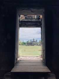 Abandoned building seen through window