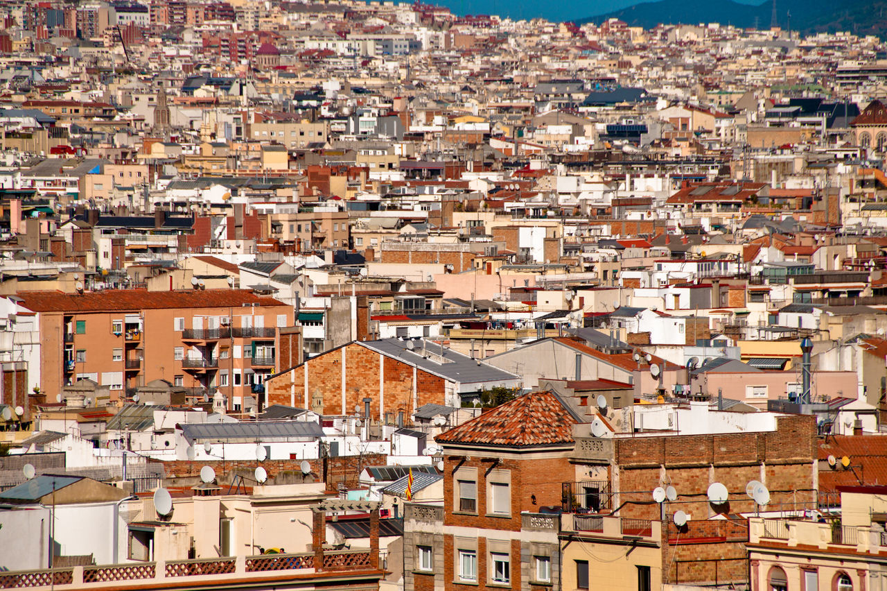 HIGH ANGLE SHOT OF TOWNSCAPE AGAINST THE SKY