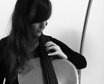 Close-up of woman with arms raised