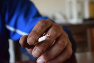 Close-up of man smoking cigarette