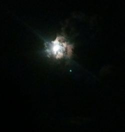 Low angle view of moon in sky at night