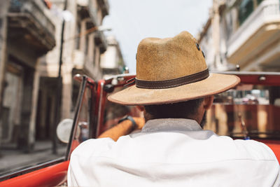 Rear view of man in hat