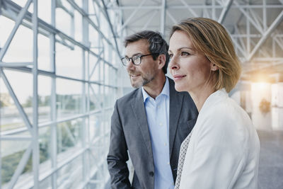 Businesswoman and businessman at the airport