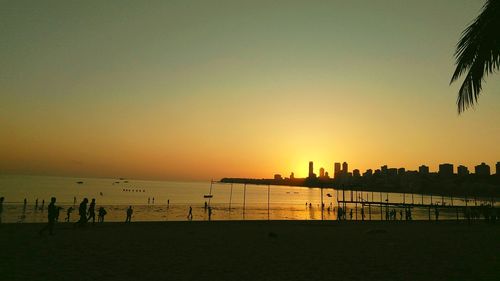 Silhouette of city at sunset