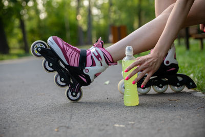 Low section of woman exercising in park