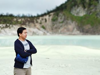 Boy standing on beach