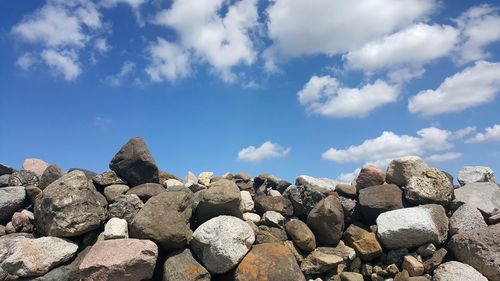 Low angle view of rocks against sky