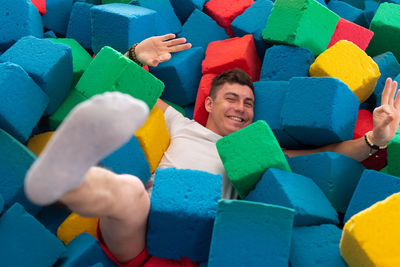 High angle view of a boy with toys