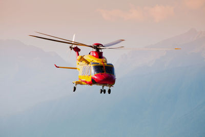 View of helicopter flying in sky