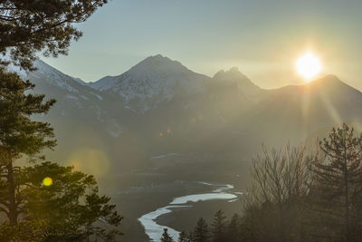 Scenic view of mountains against sky at sunset