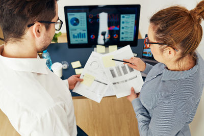 Side view of man working at office