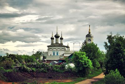 View of mosque against cloudy sky