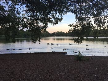 Scenic view of lake against sky during sunset