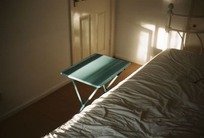 High angle view of electric lamp on bed at home