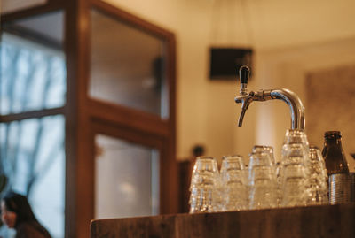 Close-up of faucet in bathroom at home