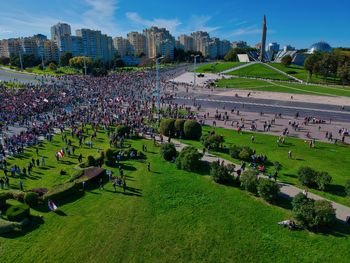 High angle view of crowd on field against sky