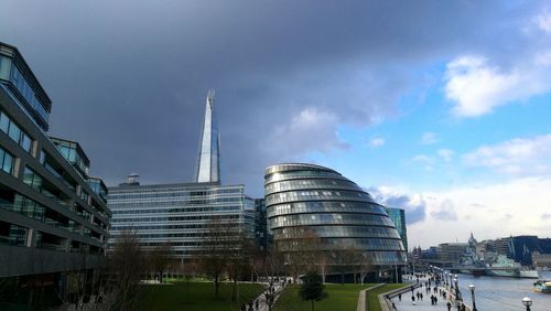 Modern buildings in city against sky