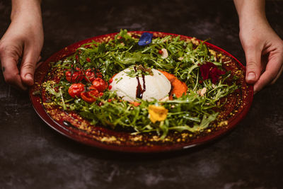 Midsection of person preparing food on table