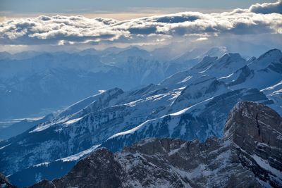 Aerial view of snowcapped mountains against sky