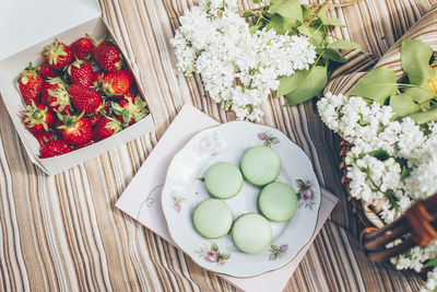 High angle view of strawberries in bowl on table