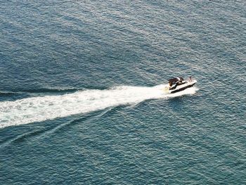 High angle view of people sailing on sea shore