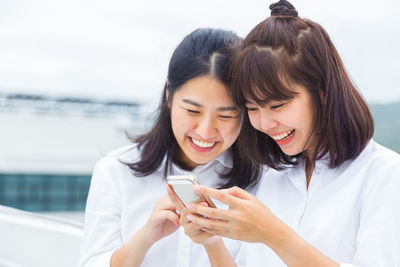 Young woman using mobile phone