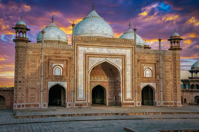 View of taj mahal gate against cloudy sky