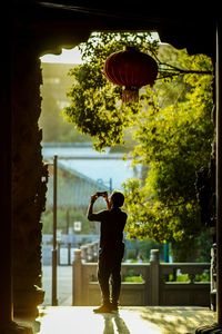 Rear view of a man standing in park