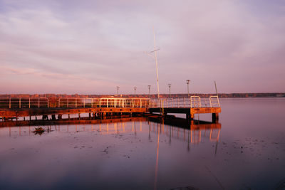 Scenic view of sailboat against sky during sunset