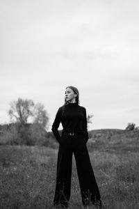 Full length of woman standing on field