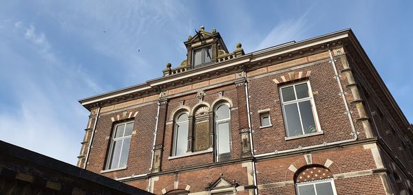 Low angle view of old building against sky