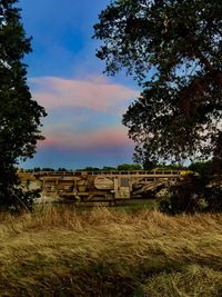 Built structure on field against sky