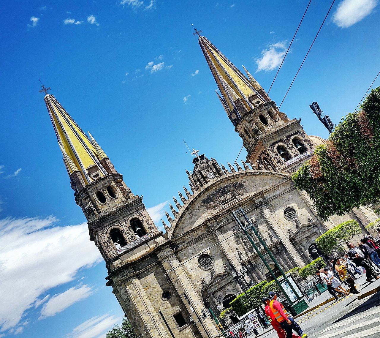 low angle view, architecture, built structure, building exterior, famous place, tower, blue, tall - high, religion, travel destinations, sky, international landmark, travel, history, tourism, place of worship, spirituality, capital cities, church